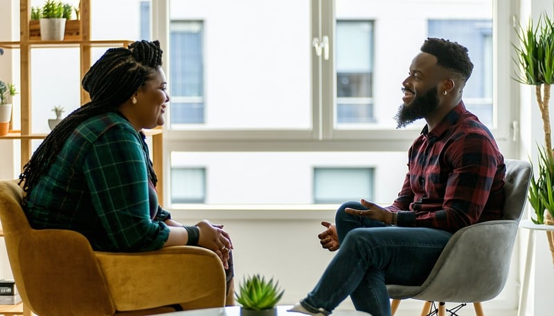 Therapist and client discussing life goals during a session at DMVLifeCoach